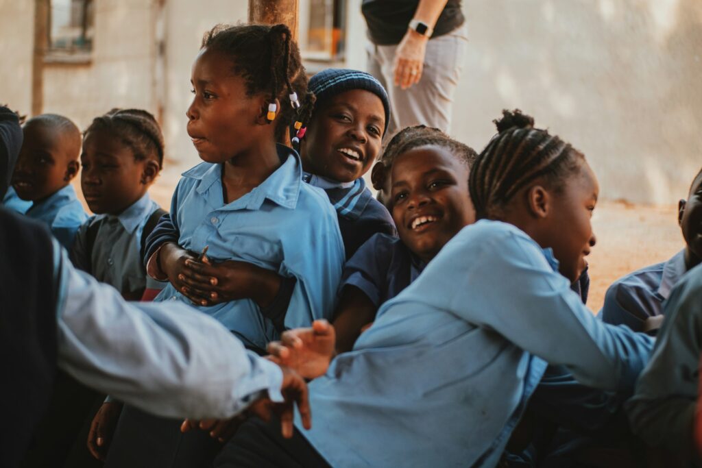 A group of young girls sitting together
