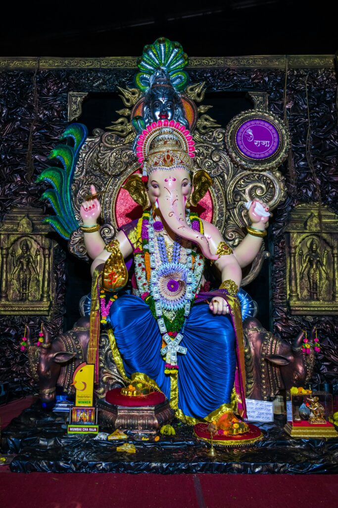 An ornate Ganesha idol decorated with garlands