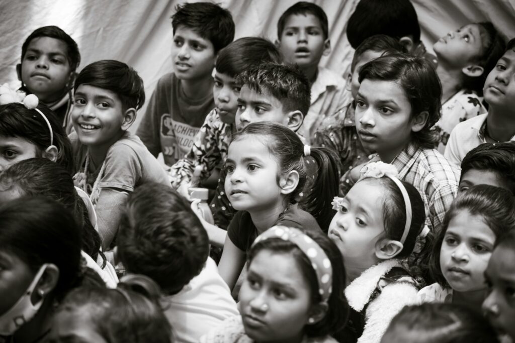 Indian schoolchildren seated together at a school event