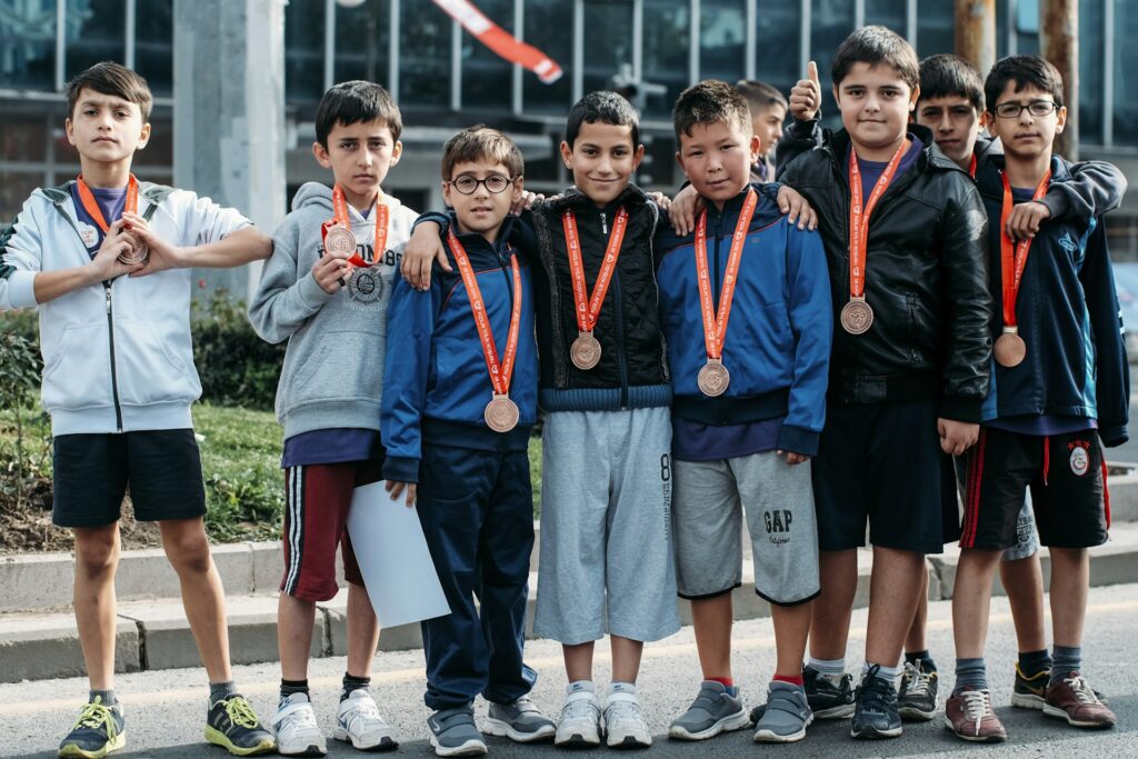 A group of children wearing their race medals